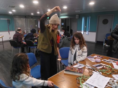 Plying thread with a drop spindle